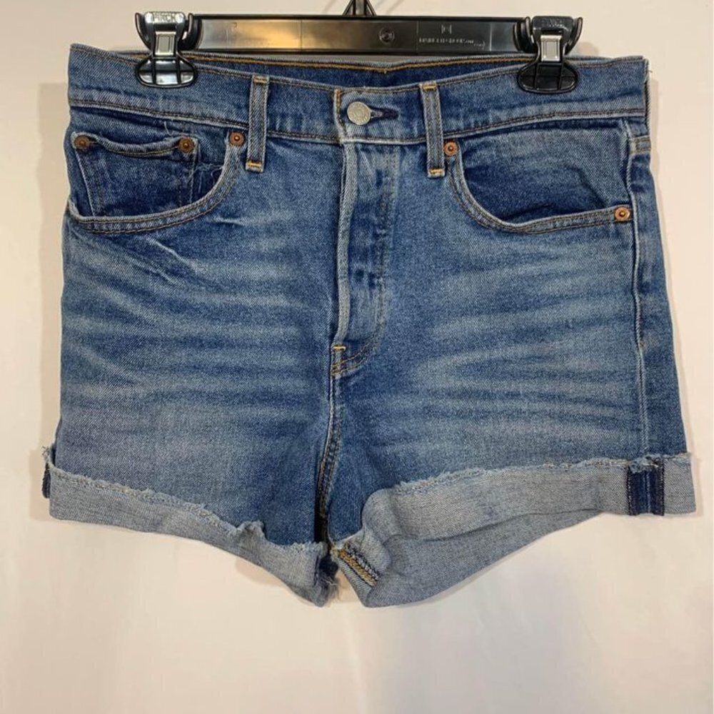 WOMAN’S LEVI STRAUSS  denim shorts. Distressed. Button fly. Size 30.